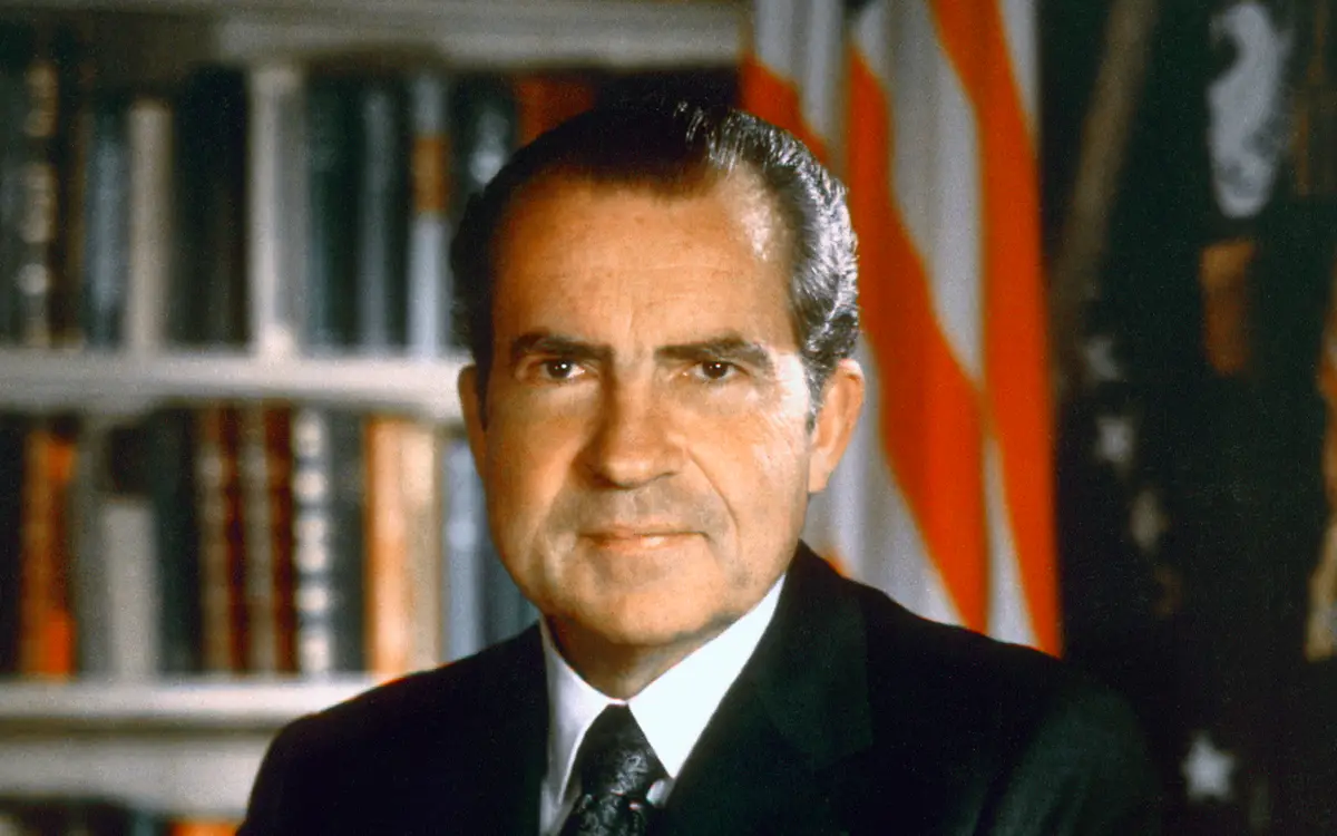 Official color portrait photograph of President Richard Nixon seated at his desk, 1971